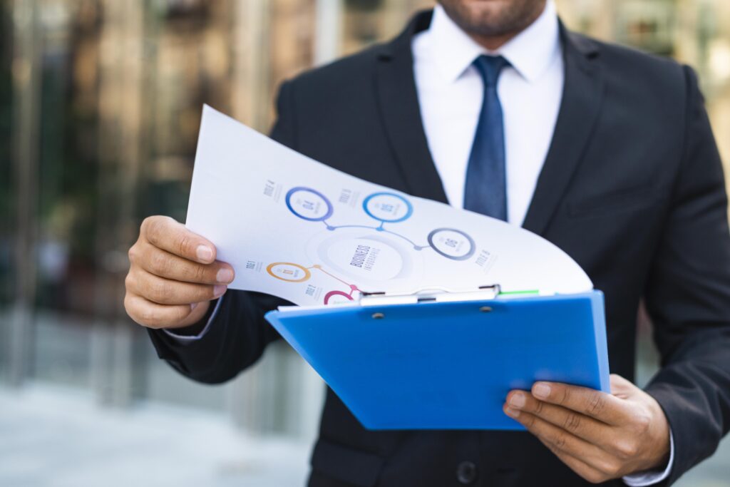 front-view-business-man-looking-charts
